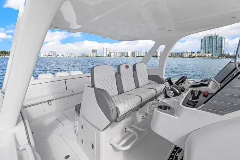 Slide: The Image of Interior view of a 2015 Cigarette 41' GTR boat on the water. - 9