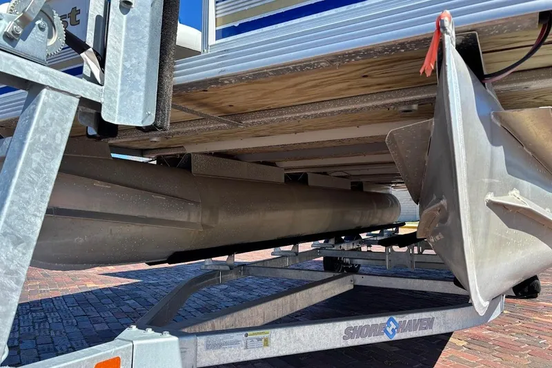 Slide: The Image of Underneath view of a 2004 Crest 2200 Family DL pontoon boat on a trailer. - 3