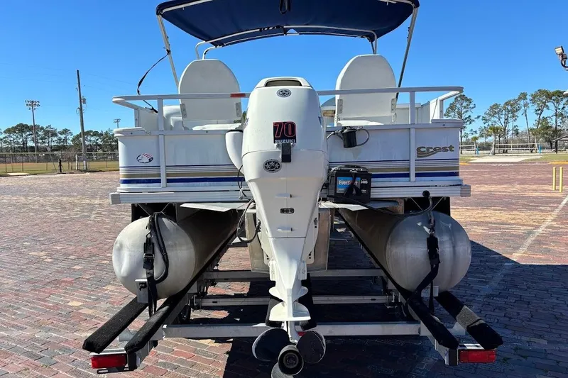 Slide: The Image of 2004 Crest 2200 Family DL pontoon boat with outboard motor on trailer. - 8