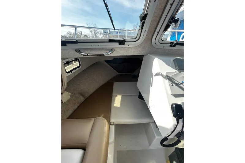 Slide: The Image of Interior view of 2019 Parker 2320 Sport Cabin boat with Garmin equipment. - 14