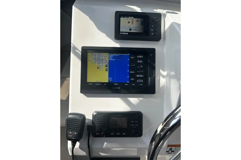 Slide: The Image of Control panel of a 2019 Parker 2320 Sport Cabin with Garmin and Yamaha displays. - 19