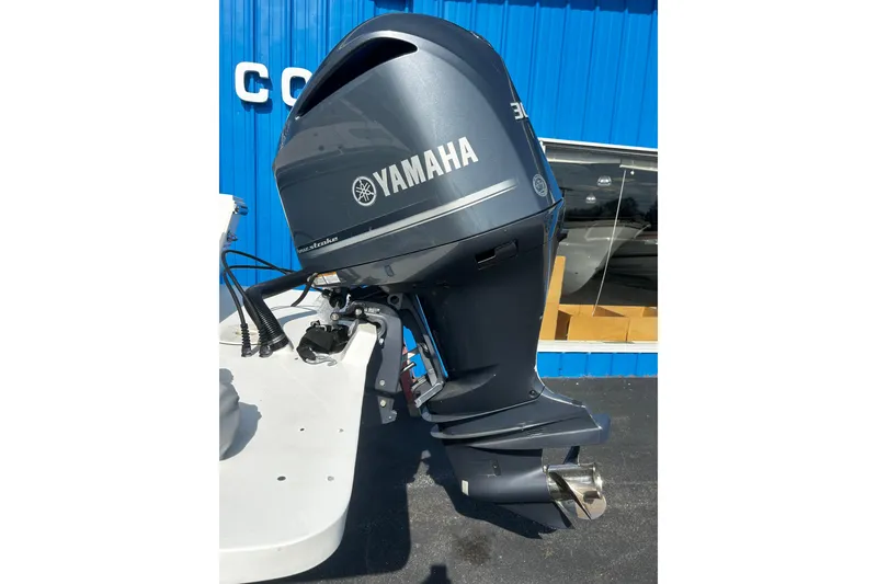Slide: The Image of Yamaha outboard motor on a 2019 Parker 2320 Sport Cabin boat. - 23