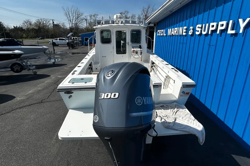 Slide: The Image of 2019 Parker 2320 Sport Cabin boat with Yamaha 300 engine at marine supply store. - 3