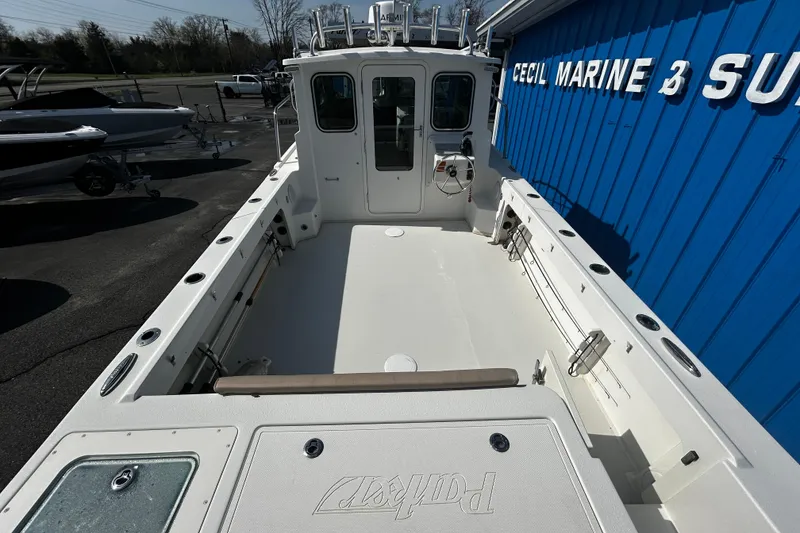Slide: The Image of 2019 Parker 2320 Sport Cabin boat at Cecil Marine, showcasing spacious deck and cabin. - 5