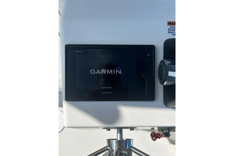 Slide: The Image of Garmin GPS device on 2019 Parker 2320 Sport Cabin boat dashboard. - 7
