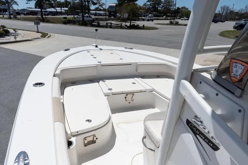 Slide: The Image of 2017 Robalo 246 Cayman boat interior with seating and storage compartments. - 13