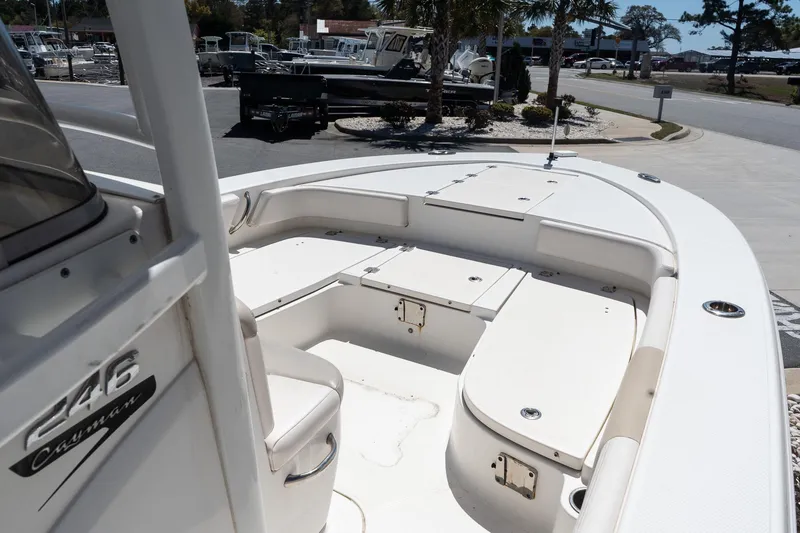Slide: The Image of 2017 Robalo 246 Cayman boat interior with seating and storage compartments. - 14