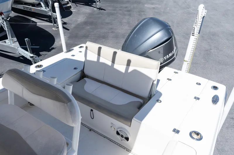 Slide: The Image of 2017 Robalo 246 Cayman boat with Yamaha engine, featuring comfortable seating and storage. - 8