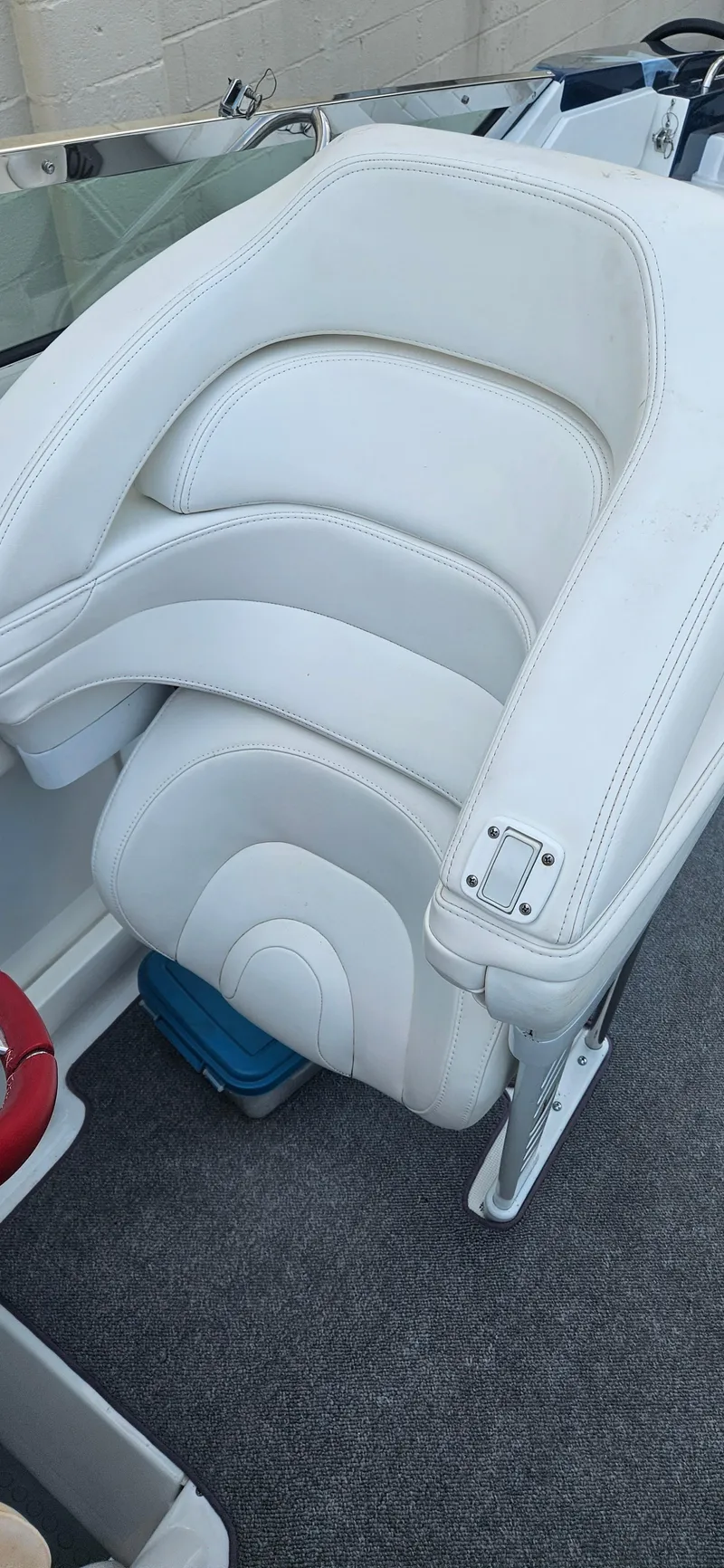 Slide: The Image of White leather seat in a 2004 Formula 382 FASTech boat interior. - 13