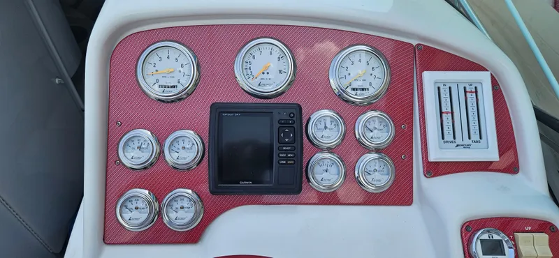 Slide: The Image of Dashboard of 2004 Formula 382 FASTech boat with gauges and controls. - 15