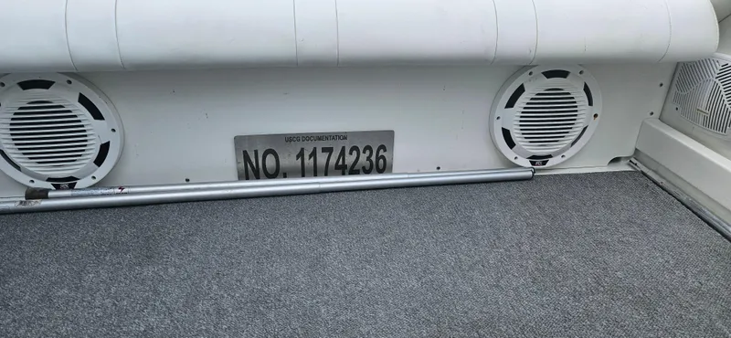 Slide: The Image of 2004 Formula 382 FASTech boat interior with speakers and registration number. - 17