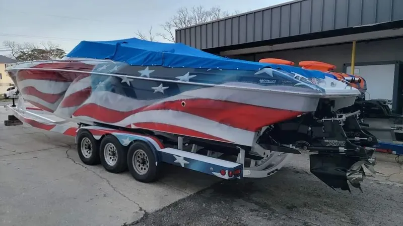 Slide: The Image of 2004 Formula 382 FASTech boat with American flag design and blue cover. - 20