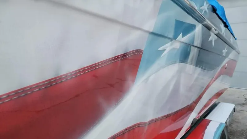 Slide: The Image of 2004 Formula 382 FASTech boat with American flag design on the hull. - 21