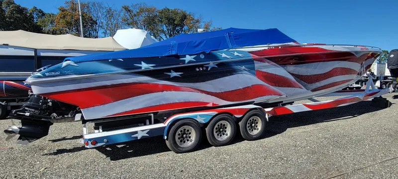 Slide: The Image of 2004 Formula 382 FASTech boat with American flag design on trailer. - 3