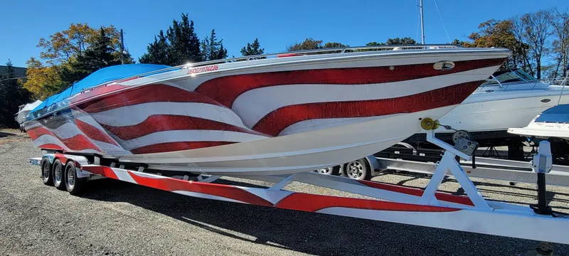 Slide: The Image of 2004 Formula 382 FASTech boat with American flag design on trailer. - 4