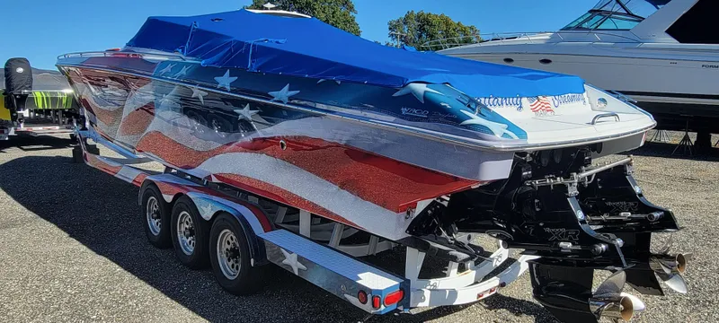 Slide: The Image of 2004 Formula 382 FASTech boat with American flag design on trailer. - 6
