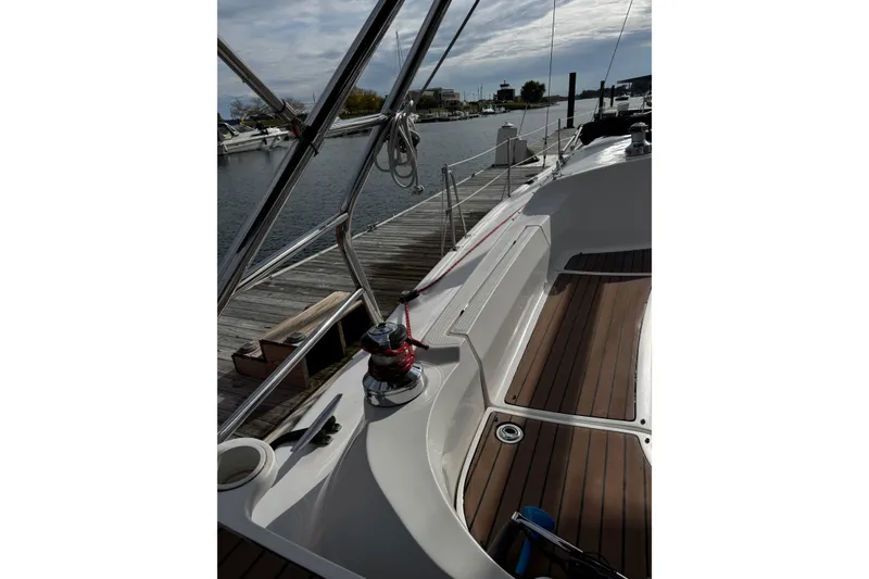 Slide: The Image of Sailboat docked at marina, Hunter 38 model, 2007, with wooden deck and winch. - 10