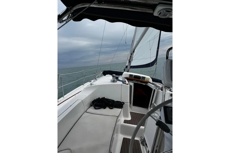 Slide: The Image of Sailing on a 2007 Hunter 38 yacht under cloudy skies. - 11