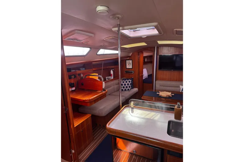 Slide: The Image of Interior of 2007 Hunter 38 sailboat with cozy seating and modern amenities. - 18