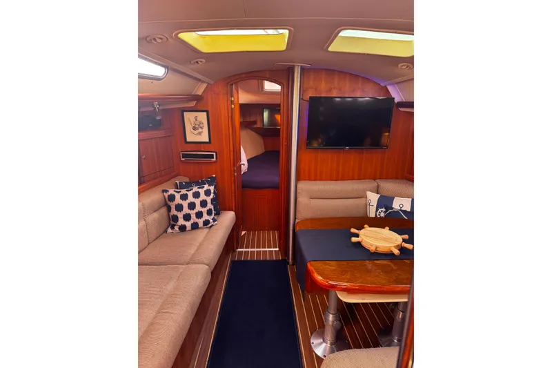 Slide: The Image of Interior of 2007 Hunter 38 sailboat with cozy seating and nautical decor. - 20