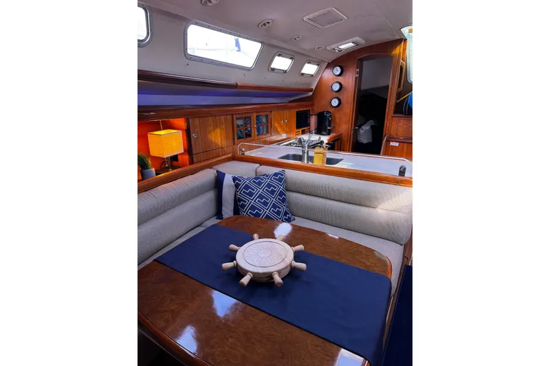 Slide: The Image of Interior of 2007 Hunter 38 sailboat with cozy seating and nautical decor. - 26