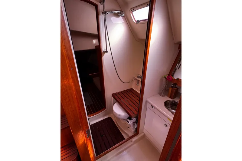 Slide: The Image of Interior of 2007 Hunter 38 sailboat bathroom with wooden accents and compact design. - 29