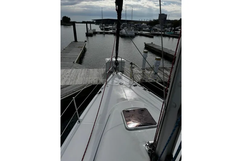 Slide: The Image of Sailboat docked at marina, Hunter 38 model, 2007, with overcast sky. - 3