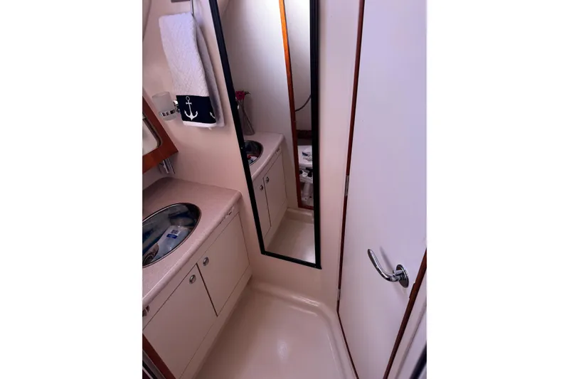 Slide: The Image of Bathroom interior of 2007 Hunter 38 yacht with mirror and sink. - 30