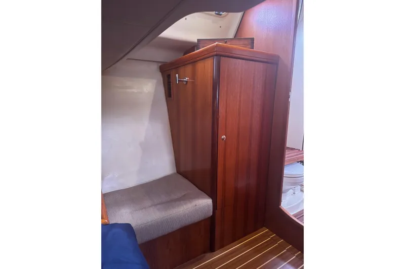 Slide: The Image of Interior of 2007 Hunter 38 sailboat with wooden cabinetry and seating area. - 39