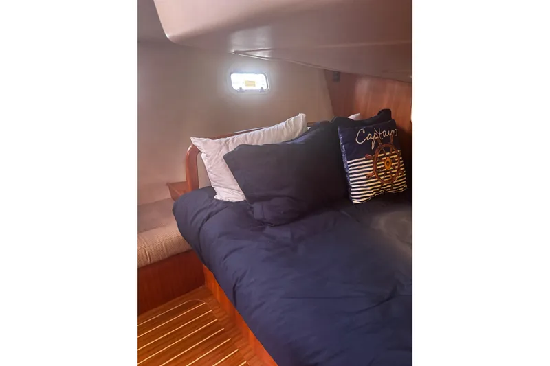 Slide: The Image of Cozy cabin interior of 2007 Hunter 38 sailboat with nautical-themed decor. - 42
