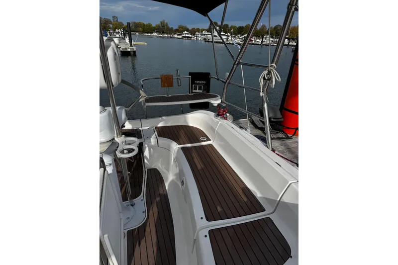 Slide: The Image of Cockpit of 2007 Hunter 38 sailboat with wooden deck, docked at marina. - 7