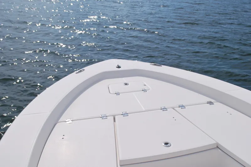 Slide: The Image of Bow of 2016 Robalo 226 Cayman boat on sparkling water. - 2