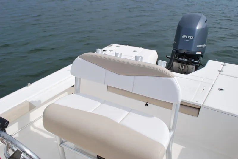 Slide: The Image of 2016 Robalo 226 Cayman boat interior with Yamaha 200 engine on water. - 9