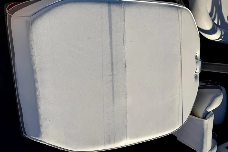 Slide: The Image of White upholstery on a 1993 Nautique Sport Nautique 200 boat seat. - 11