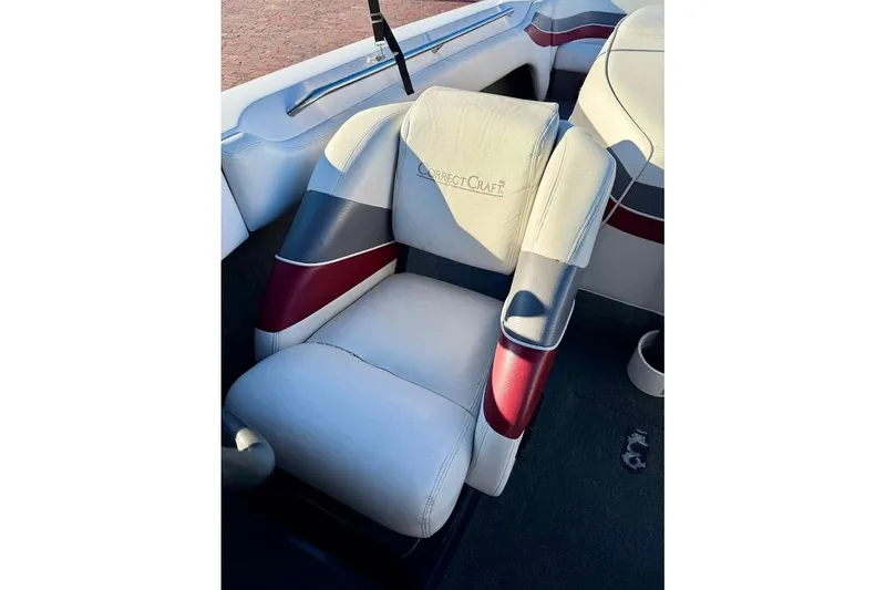 Slide: The Image of 1993 Nautique Sport Nautique 200 boat seat with red and gray accents. - 15