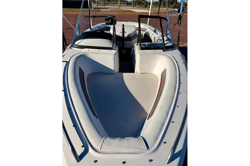 Slide: The Image of 1993 Nautique Sport Nautique 200 boat interior with white seating and open bow design. - 6