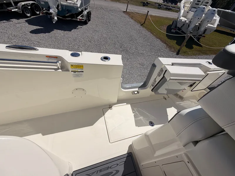 Slide: The Image of Interior view of the 2026 Cobia 245CC boat deck. - 12