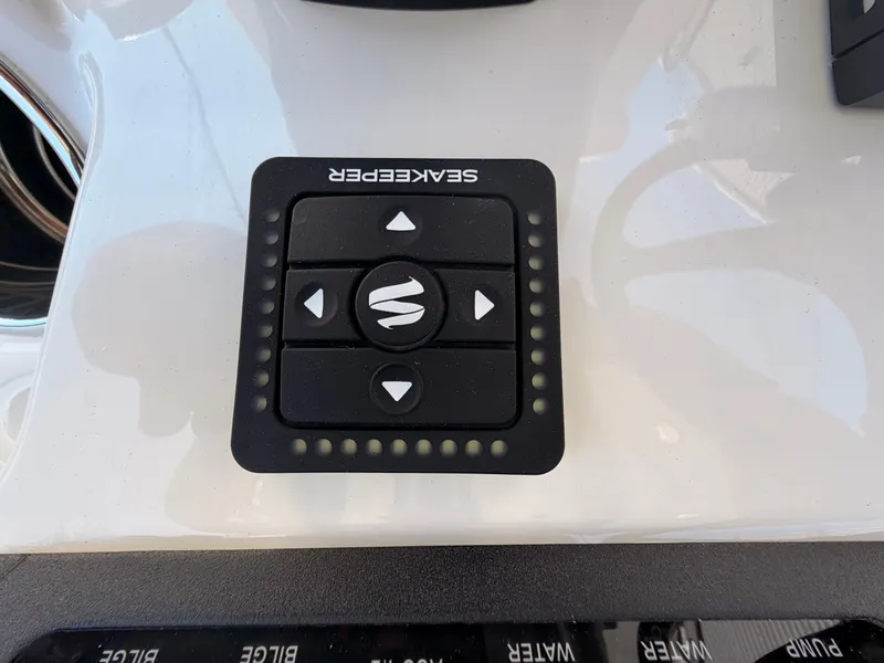 Slide: The Image of Control panel on a 2026 Cobia 245CC boat. - 14