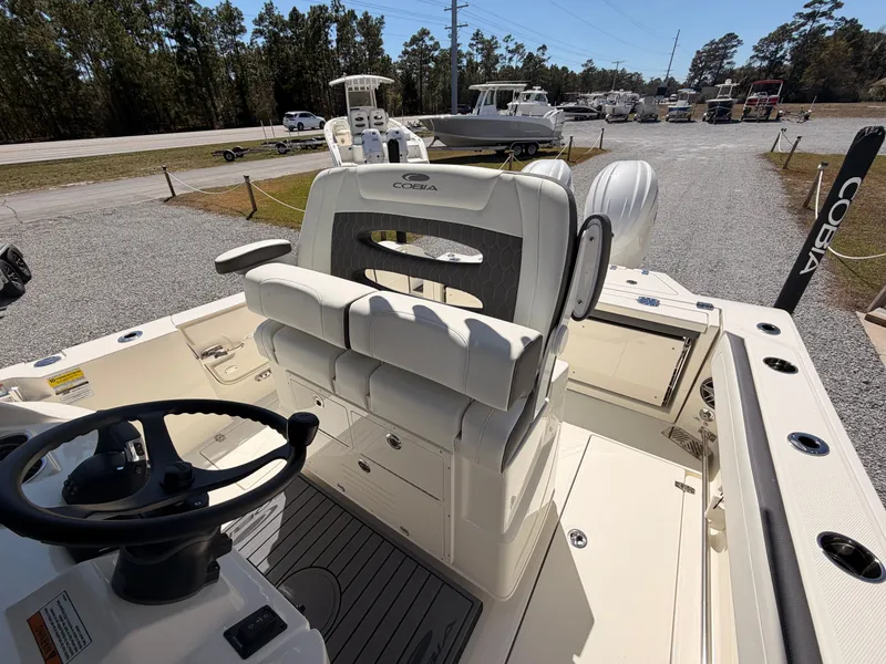 Slide: The Image of Interior view of 2026 Cobia 245CC boat with helm station. - 15