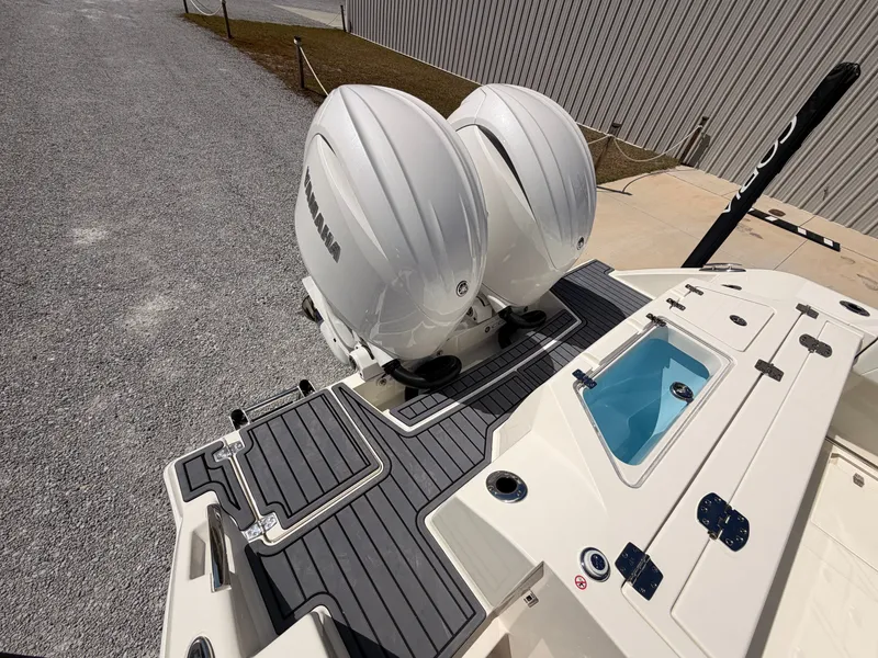 Slide: The Image of Cobia 245CC 2026 with twin outboard engines and blue livewell. - 23