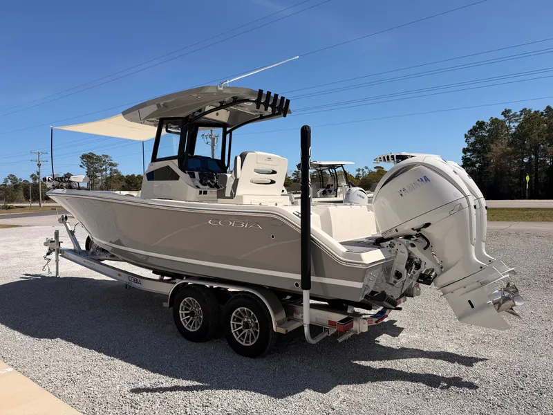 Slide: The Image of 2026 Cobia 245CC boat on trailer, exterior view. - 4