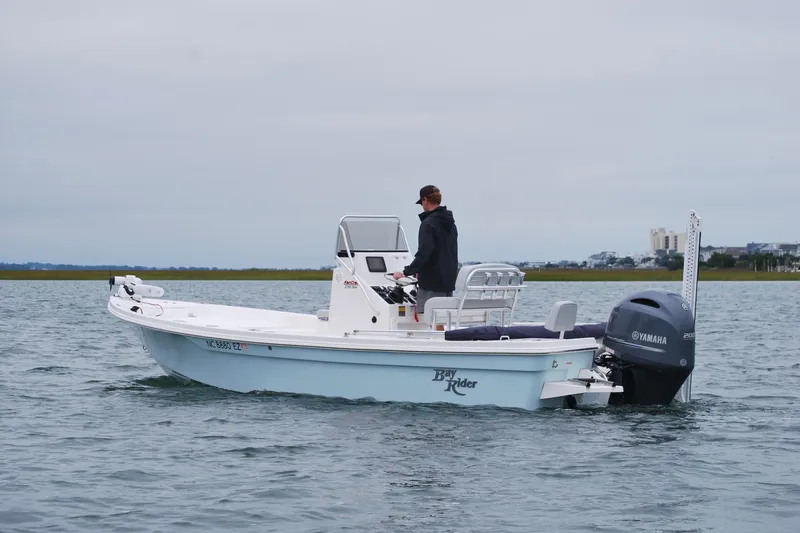 The Image of 2023 Bay Rider 239 Bay boat on water with Yamaha engine, person steering. - 0