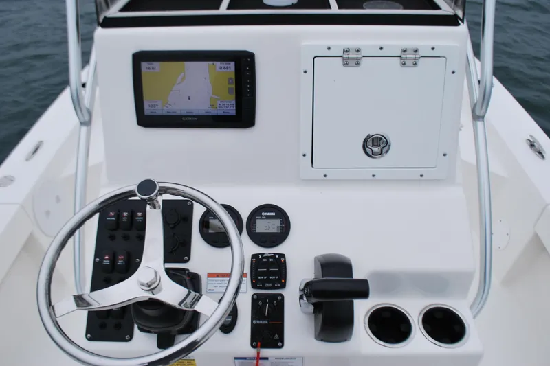 Slide: The Image of 2023 Bay Rider 239 Bay boat console with steering wheel and navigation system. - 14