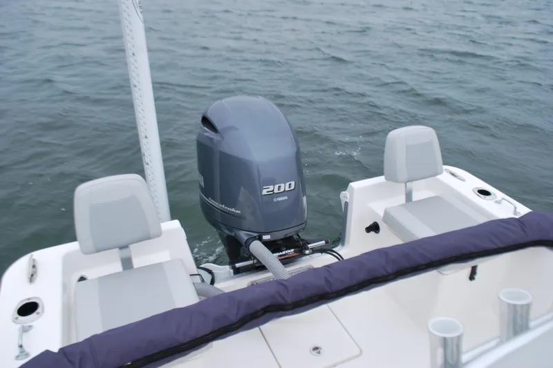 Slide: The Image of 2023 Bay Rider 239 Bay boat with Yamaha 200 outboard motor on water. - 19
