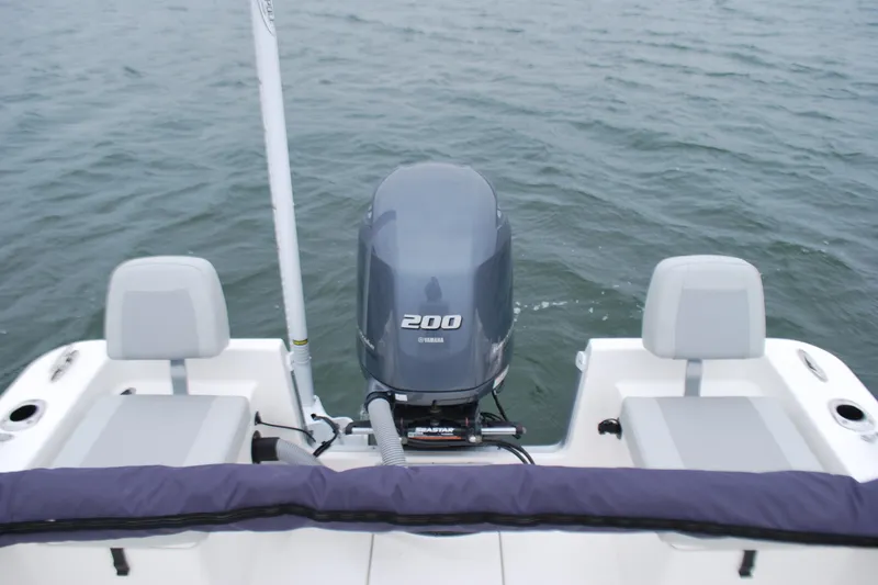 Slide: The Image of 2023 Bay Rider 239 Bay boat with Yamaha 200 engine on water. - 20