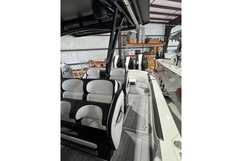 Slide: The Image of 2026 Nor-Tech 390 Sport Center Console interior with sleek seating and modern design. - 12