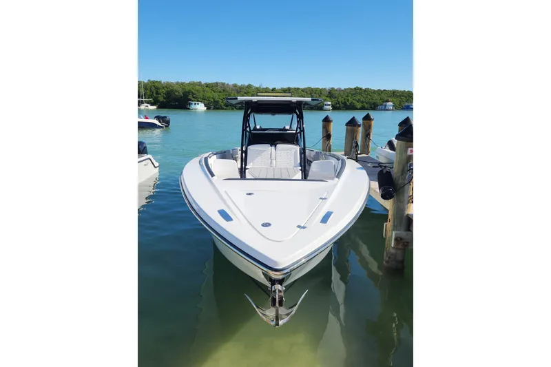 Slide: The Image of 2026 Nor-Tech 390 Sport Center Console boat docked in clear water. - 16