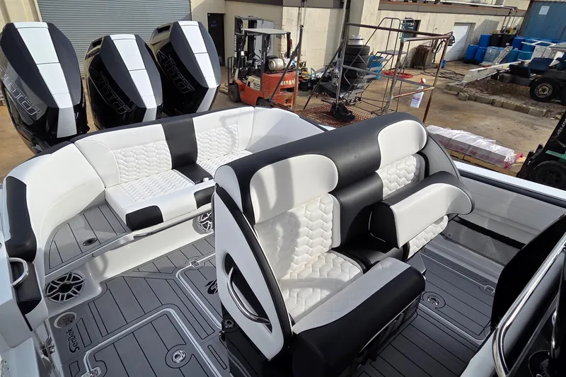 Slide: The Image of 2026 Nor-Tech 390 Sport Center Console with luxurious seating and powerful outboard engines. - 28