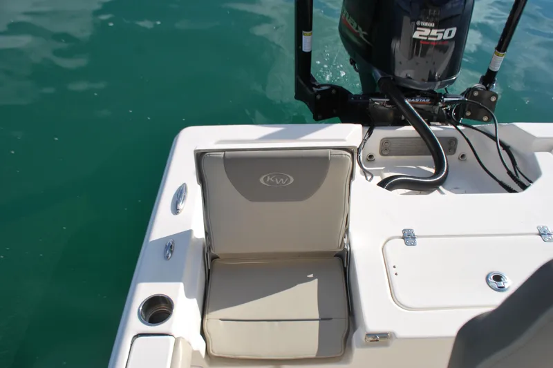 Slide: The Image of 2021 Key West 210 Bay Reef boat with Yamaha 250 engine, rear seating, and cup holder. - 17