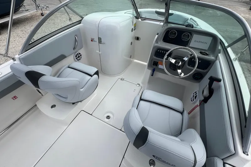 Slide: The Image of 2026 Robalo R207 Dual Console boat interior with modern dashboard and comfortable seating. - 15